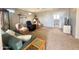 Cozy living room with plush armchairs, a comfortable sofa, and views into the adjacent bathroom at 381 S Gypsum Dr, Apache Junction, AZ 85119