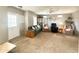 Bright living room showcasing comfortable seating, a display case, and a welcoming entrance for Gathering and friends at 381 S Gypsum Dr, Apache Junction, AZ 85119