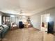 Relaxing living room featuring a ceiling fan, comfortable seating, and natural light creating a serene atmosphere at 381 S Gypsum Dr, Apache Junction, AZ 85119