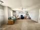Bright living room featuring comfortable seating, a decorative display case, and ample space for entertaining guests at 381 S Gypsum Dr, Apache Junction, AZ 85119