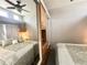 Comfortable main bedroom featuring wood cabinets, mirrors, and lots of natural light from above at 381 S Gypsum Dr, Apache Junction, AZ 85119