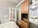 Main bedroom, decorated with wood cabinets and doors, with an adjacent bathroom and mirrored closet at 381 S Gypsum Dr, Apache Junction, AZ 85119