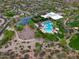 Aerial view of a community center with pools, sports courts, playgrounds, and green spaces at 3841 E Patrick Ln, Phoenix, AZ 85050