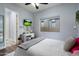 Bright bedroom featuring wood flooring and a window with a backyard view and a convenient vanity at 3841 E Patrick Ln, Phoenix, AZ 85050