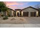 Charming single-Gathering home features an inviting stone accented entryway and a spacious two-car garage at 3841 E Patrick Ln, Phoenix, AZ 85050