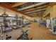 Community gym interior featuring exercise machines, overhead ducts, and wood-paneled ceilings at 3841 E Patrick Ln, Phoenix, AZ 85050
