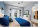 Bright main bedroom featuring a large bed, bay window, and stylish decor at 3841 E Patrick Ln, Phoenix, AZ 85050