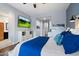 Comfortable main bedroom with a king-size bed, stylish decor, and a wall-mounted television at 3841 E Patrick Ln, Phoenix, AZ 85050