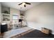 Bright office space boasts a large window, built-in shelves, and modern decor with light gray walls at 3841 E Patrick Ln, Phoenix, AZ 85050