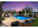 Inviting backyard pool area with a lounge chair, seating, and a serene atmosphere perfect for relaxation and entertaining at 3841 E Patrick Ln, Phoenix, AZ 85050