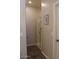 Bathroom hallway featuring glass shower doors and a neutral color palette at 3850 E Balsam Dr, Chandler, AZ 85286