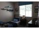 Nautical-themed bedroom featuring a single bed, shark decor, blue accents, and window with natural light at 3850 E Balsam Dr, Chandler, AZ 85286