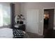 Bright bedroom featuring a vanity with round mirror, desk, and sliding closet doors at 3850 E Balsam Dr, Chandler, AZ 85286