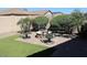 Beautiful backyard fire pit with chairs, perfect for outdoor entertaining at 3850 E Balsam Dr, Chandler, AZ 85286