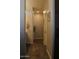 Narrow hallway with hardwood flooring and access to rooms including the bathroom at 3850 E Balsam Dr, Chandler, AZ 85286