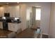Well-lit kitchen and dining area featuring white cabinets, granite countertops, and stainless steel appliances at 3850 E Balsam Dr, Chandler, AZ 85286