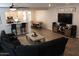 Open-concept living area with modern furniture, a ceiling fan and sleek flooring at 3850 E Balsam Dr, Chandler, AZ 85286