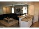 Inviting living room featuring a granite-topped kitchen island, plush black couch, and stylish decor for relaxed living at 3850 E Balsam Dr, Chandler, AZ 85286
