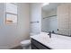 Bathroom featuring modern vanity with dark hardware and natural light at 39965 W Bunker Dr, Maricopa, AZ 85138