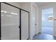 Bathroom featuring a glass shower and modern fixtures at 39965 W Bunker Dr, Maricopa, AZ 85138