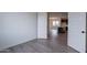 Bedroom featuring modern floors and an open view into the living space at 39965 W Bunker Dr, Maricopa, AZ 85138
