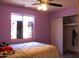 Inviting bedroom with a comfortable bed, tiled flooring, and a window at 4116 N 78Th Ave, Phoenix, AZ 85033