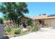 Single-story home with vibrant flowering bushes along the front yard at 4116 N 78Th Ave, Phoenix, AZ 85033