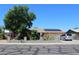 Charming single-story home with a well-kept front yard and solar panels on the roof at 4116 N 78Th Ave, Phoenix, AZ 85033