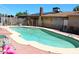 Refreshing pool with a red brick patio and a view of the home's exterior at 4116 N 78Th Ave, Phoenix, AZ 85033