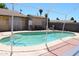 Backyard pool surrounded by brick patio and houses at 4116 N 78Th Ave, Phoenix, AZ 85033