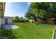 Expansive backyard with well-maintained lawn, fire pit and a shed for extra storage at 4314 E Montecito Ave, Phoenix, AZ 85018