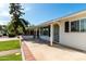 Cozy covered porch with stylish door and black window shutters at 4314 E Montecito Ave, Phoenix, AZ 85018