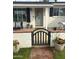 Charming home featuring a lovely entrance with a quaint black gate and potted flowers at 4314 E Montecito Ave, Phoenix, AZ 85018