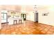 Open floor plan with bright kitchen, white cabinets, breakfast bar, and unique tiled flooring at 4314 E Montecito Ave, Phoenix, AZ 85018