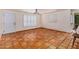 Bright, minimalist room with tile floors and shutters at 4314 E Montecito Ave, Phoenix, AZ 85018