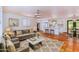 Bright living room showcasing stylish furnishings, terracotta floors, and a seamless flow to the kitchen at 4314 E Montecito Ave, Phoenix, AZ 85018