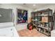 This storage room features shelving, peg board and Saltillo tile flooring at 4314 E Montecito Ave, Phoenix, AZ 85018