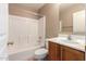 Bright bathroom features a shower-tub combo and single sink vanity at 4347 W Darrel Rd, Laveen, AZ 85339