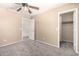 Neutral bedroom with a ceiling fan, carpet and a closet at 4347 W Darrel Rd, Laveen, AZ 85339