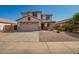 Inviting two-story home showcasing a well-maintained lawn and a two car garage at 4347 W Darrel Rd, Laveen, AZ 85339