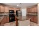 Functional kitchen featuring stainless steel appliances and a central island at 4347 W Darrel Rd, Laveen, AZ 85339