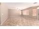 Open living area with ceiling fan, neutral paint, and tile flooring at 4347 W Darrel Rd, Laveen, AZ 85339