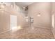 Spacious living room featuring a staircase, high ceilings, tile flooring, and abundant natural light at 4347 W Darrel Rd, Laveen, AZ 85339