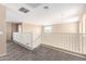Open loft area featuring white railing overlooking staircase and adjacent rooms at 4347 W Darrel Rd, Laveen, AZ 85339