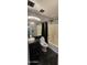 Bathroom with sleek black counter and sink, shower-tub combo with dark shower curtains at 5311 W Fulton St, Phoenix, AZ 85043