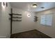 Bedroom featuring dark accent shelves and window at 5311 W Fulton St, Phoenix, AZ 85043