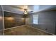 Bedroom featuring gray walls and planked accent wall at 5311 W Fulton St, Phoenix, AZ 85043