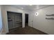 Bedroom featuring dark shelves, closet and bathroom access at 5311 W Fulton St, Phoenix, AZ 85043