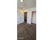 Bedroom features carpeted floors and built-in closet with pink trim at 5311 W Fulton St, Phoenix, AZ 85043