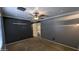 Bedroom featuring gray walls, a ceiling fan, and access to the bathroom at 5311 W Fulton St, Phoenix, AZ 85043